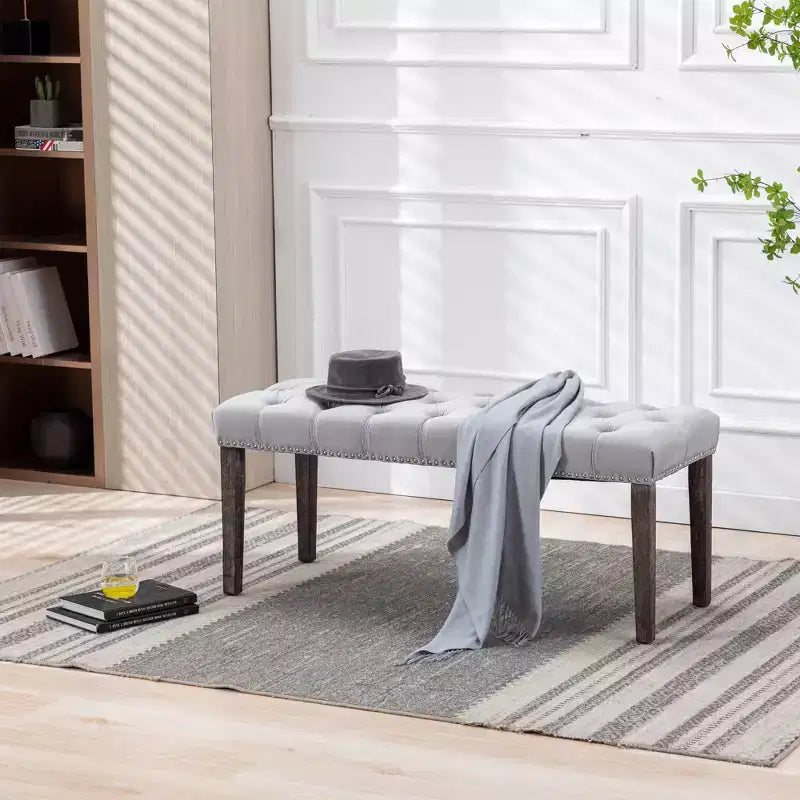 Banc capitonné en velours avec pieds en bois